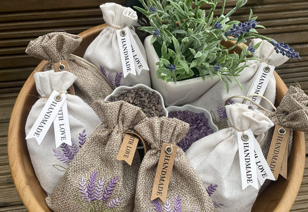 scented lavender sachets in a wooden bowl with greenery handmade gifts six unique designs